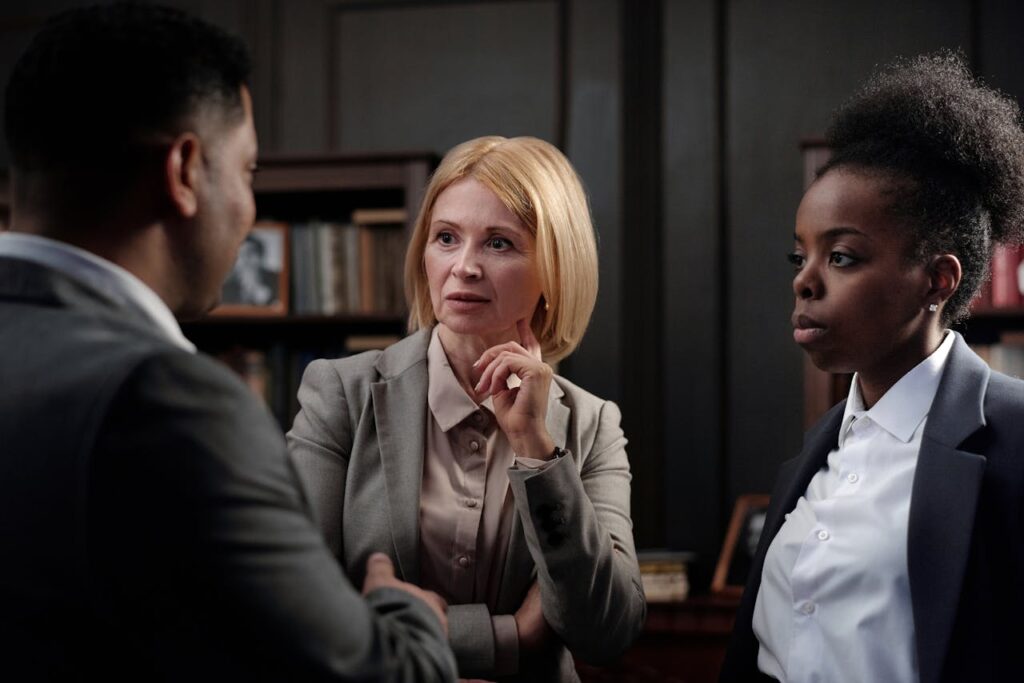 Business professionals engaged in a team meeting in an office environment.