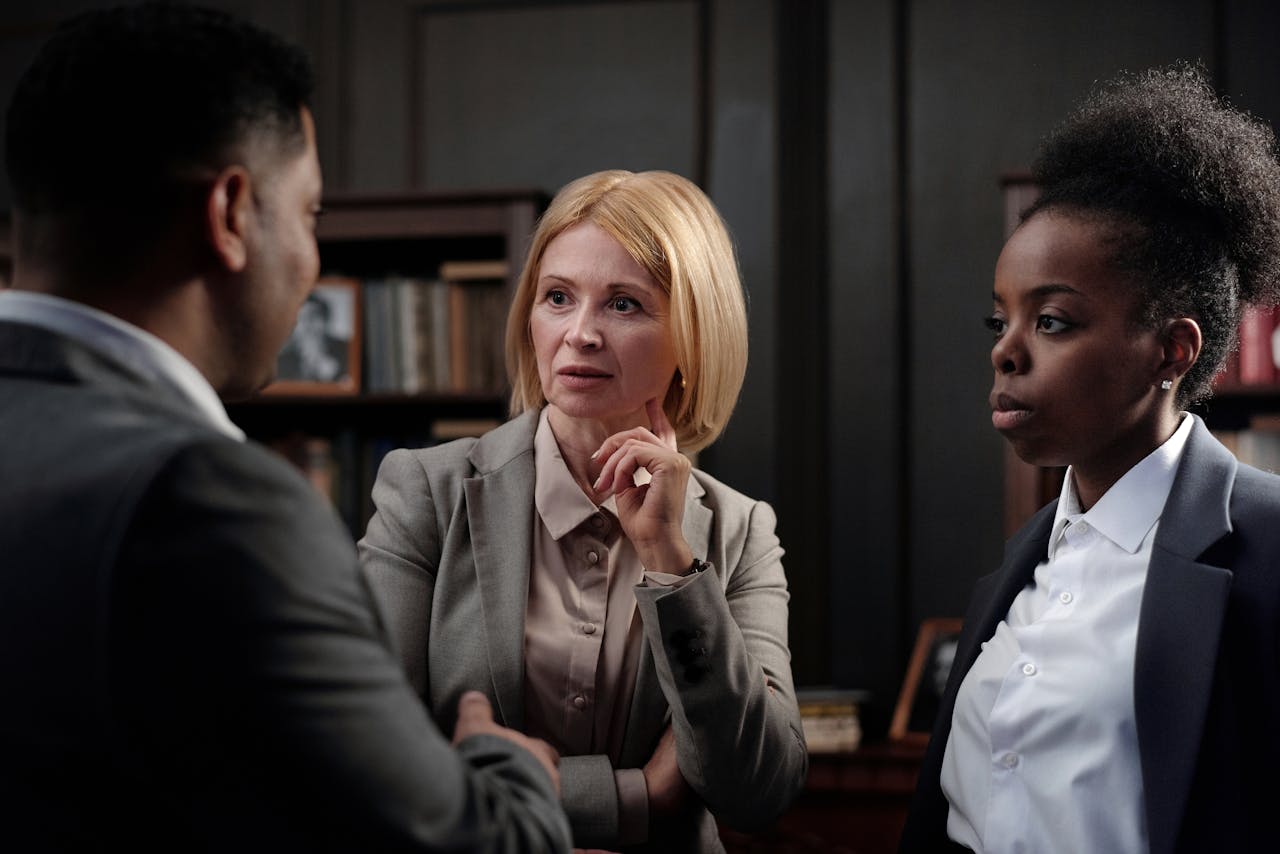 Business professionals engaged in a team meeting in an office environment.